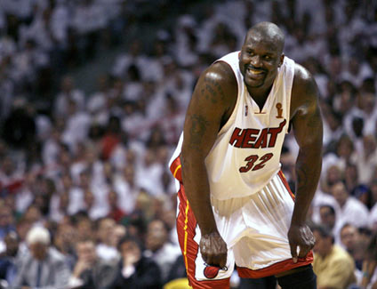 miami heat's shaquille o'neal smiles at a teammate in the second