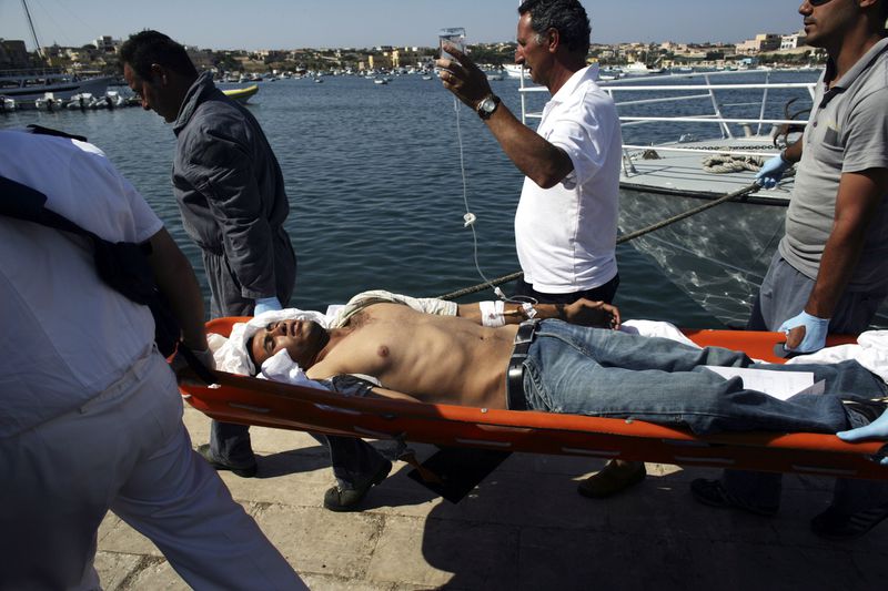 lampedusa migrant on stretcher