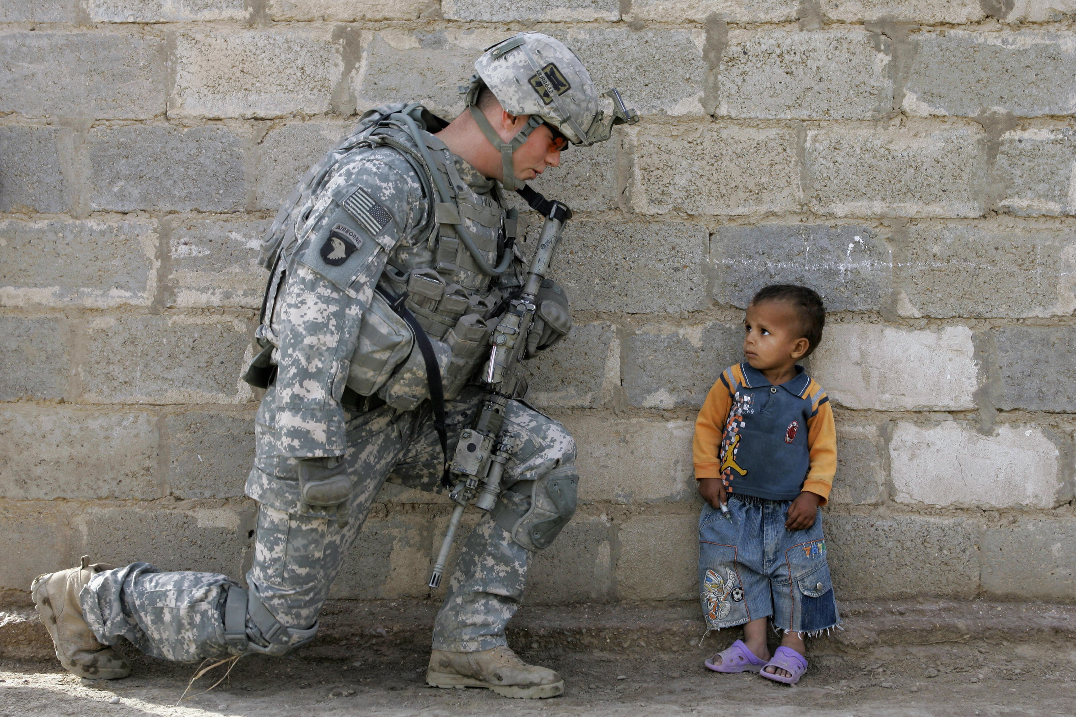 A US soldier with an Iraqi child in Baghdad, 2008. Mauricio Lima/AFP/Getty Images