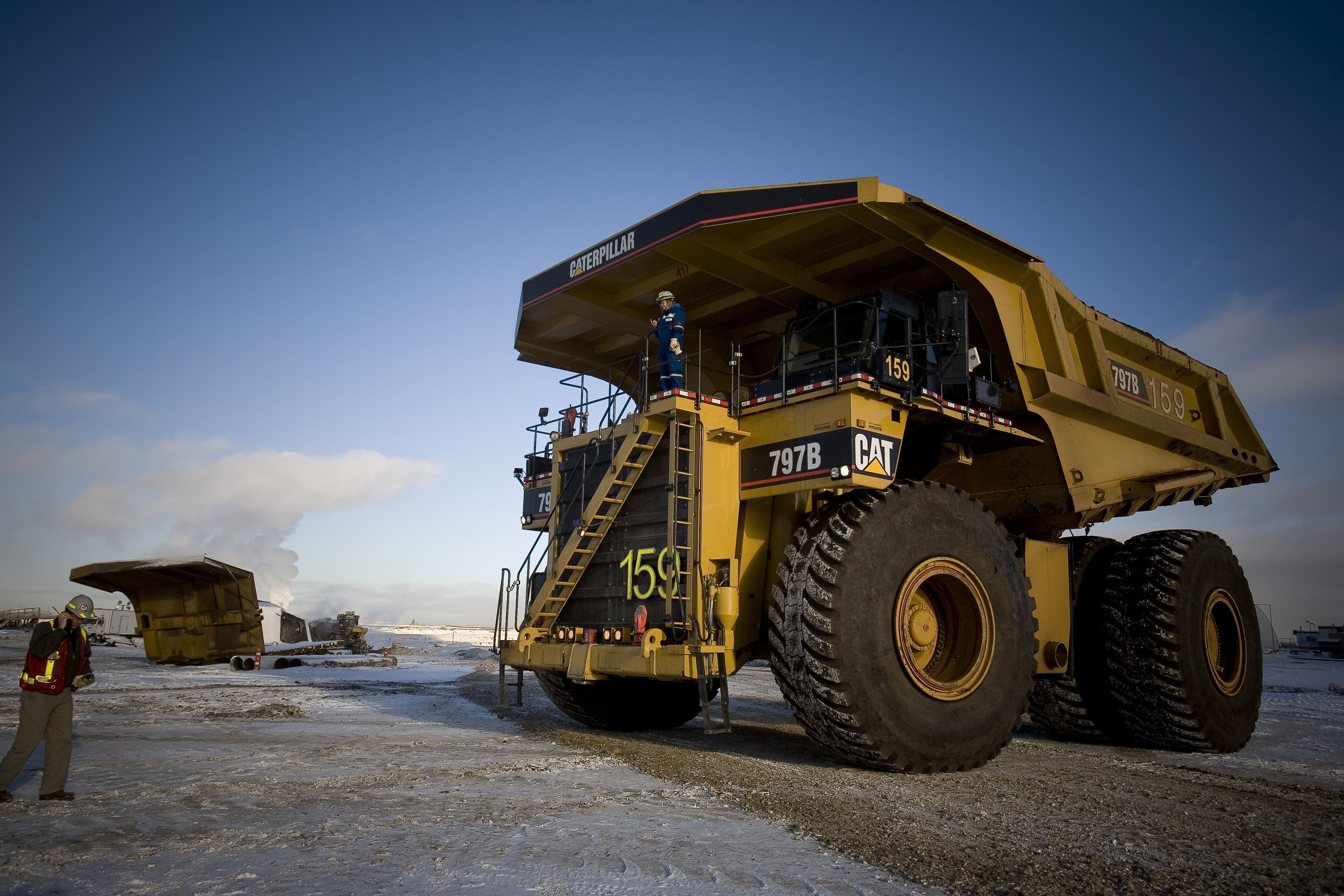 Trucks operating in the oil sands of Alberta, Canada. (Veronqiue de Viguerie/Getty Images)