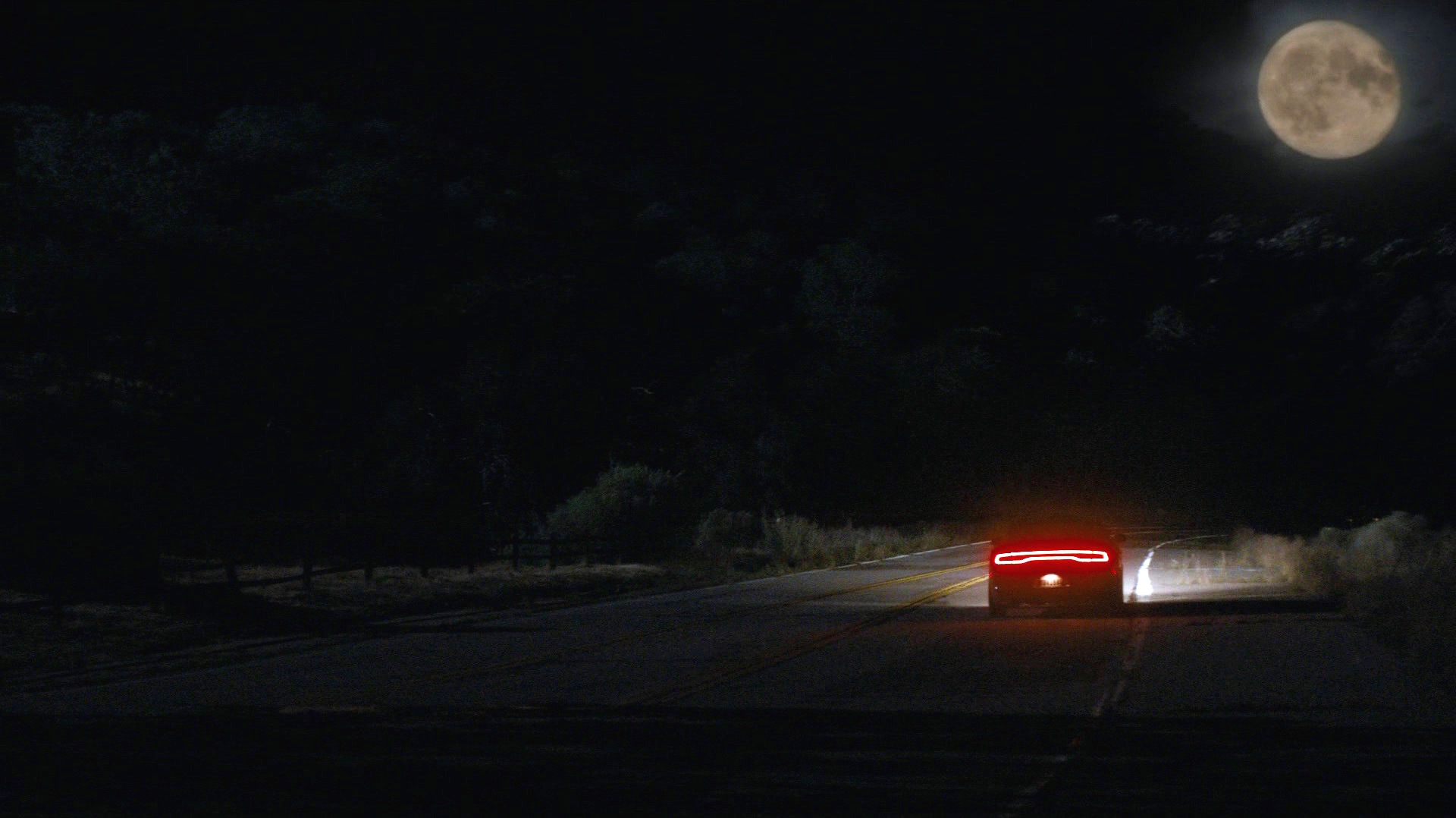 Ray's Charger drives into the moonrise